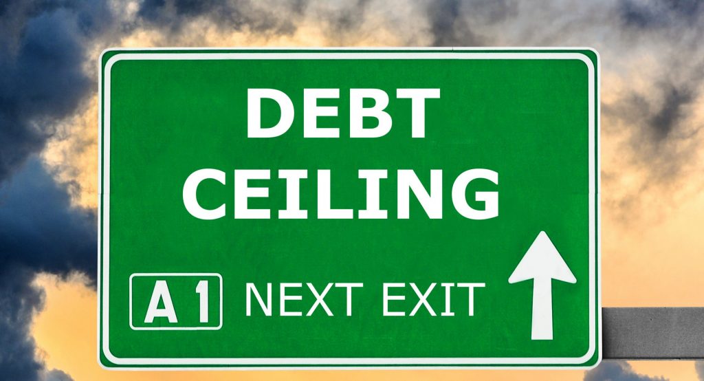 Debt,Ceiling,Road,Sign,Against,Clear,Blue,Sky